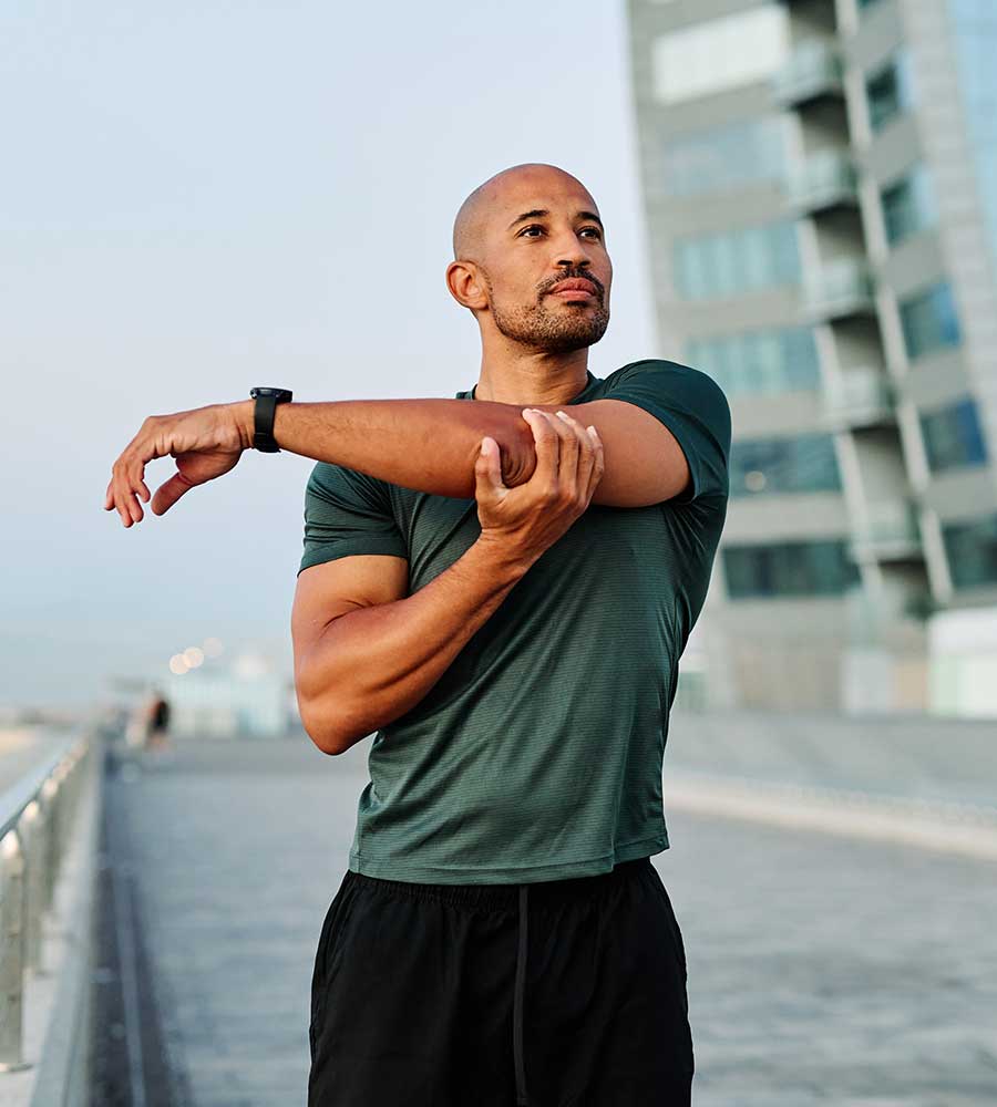 Man stretching and feeling better after peptide therapy